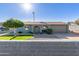 Charming single-story home features a well-manicured lawn, desert landscaping, and a two-car garage at 1620 N 72Nd Ln, Phoenix, AZ 85035