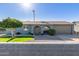 Charming single-story home features a well-manicured lawn, desert landscaping, and a two-car garage at 1620 N 72Nd Ln, Phoenix, AZ 85035