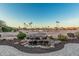 Backyard water feature with a beautiful view of the community golf course and desert landscape at 16422 W Alvarado Dr, Goodyear, AZ 85395