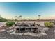 Backyard water feature with a beautiful view of the community golf course and desert landscape at 16422 W Alvarado Dr, Goodyear, AZ 85395