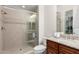 Bathroom with granite counter, glass enclosed shower, and tiled accents at 16422 W Alvarado Dr, Goodyear, AZ 85395