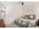 Cozy bedroom featuring crown molding, neutral carpet and natural light at 16422 W Alvarado Dr, Goodyear, AZ 85395