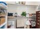 Walk in closet with shelves and various items stored inside at 16422 W Alvarado Dr, Goodyear, AZ 85395