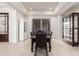 Dining room with dining table and seating for six, glass display case at 16422 W Alvarado Dr, Goodyear, AZ 85395