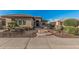 Charming home with brick walkway and desert landscaping, and stone accents at 16422 W Alvarado Dr, Goodyear, AZ 85395