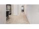 Hallway featuring a tile floor, and view to dining room at 16422 W Alvarado Dr, Goodyear, AZ 85395