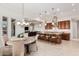 Open concept eat-in kitchen, with long island, that leads into the living room at 16422 W Alvarado Dr, Goodyear, AZ 85395