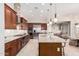 Gourmet kitchen featuring granite counters, stainless appliances, and a large center island at 16422 W Alvarado Dr, Goodyear, AZ 85395