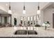 Eat-in kitchen offers a large island with a double sink, and lovely pendant lights at 16422 W Alvarado Dr, Goodyear, AZ 85395