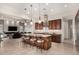 Spacious eat-in kitchen with center island that flows into the living room at 16422 W Alvarado Dr, Goodyear, AZ 85395