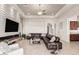 Living room with a cozy fireplace and tile floors at 16422 W Alvarado Dr, Goodyear, AZ 85395