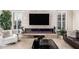 Living room showcasing fireplace, sleek decor, and tile flooring at 16422 W Alvarado Dr, Goodyear, AZ 85395