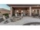 Covered patio with comfortable seating and an outdoor firepit at 16422 W Alvarado Dr, Goodyear, AZ 85395