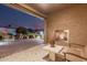 Outdoor patio with an outdoor fireplace and a view of the neighborhood at 16422 W Alvarado Dr, Goodyear, AZ 85395