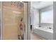 This bathroom features a glass shower and a separate tub, ensuring a relaxing experience at 1673 S 218Th Ave, Buckeye, AZ 85326