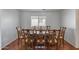 A formal dining room featuring a wooden table set for a meal with decorative chairs and tile flooring at 1673 S 218Th Ave, Buckeye, AZ 85326