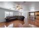 Living room featuring tile floors, a ceiling fan, and a view of the kitchen at 1673 S 218Th Ave, Buckeye, AZ 85326