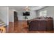 Open living room with tile floors, large TV, and comfortable seating at 1673 S 218Th Ave, Buckeye, AZ 85326