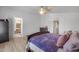 Large main bedroom shows a glimpse of the bath in an open and bright interior at 1673 S 218Th Ave, Buckeye, AZ 85326
