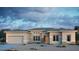 Contemporary home featuring a neutral color scheme, well-manicured landscaping, and a spacious two-car garage at 18921 E Ashridge Dr, Queen Creek, AZ 85142