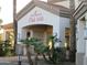 Exterior view of Solana Club 1941 entrance, featuring palm trees and desert landscaping at 1941 S Pierpont Dr # 2082, Mesa, AZ 85206