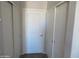 Hallway with closet doors and neutral carpet at 1941 S Pierpont Dr # 2082, Mesa, AZ 85206