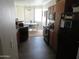 Kitchen with dark cabinets and appliances at 1941 S Pierpont Dr # 2082, Mesa, AZ 85206