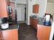 Functional kitchen with wooden cabinets, countertop, sink, and appliances at 1941 S Pierpont Dr # 2082, Mesa, AZ 85206