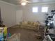 Spacious living room features a comfortable sofa and bright windows, creating an ideal living space at 1941 S Pierpont Dr # 2082, Mesa, AZ 85206