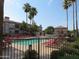Community pool area with inviting turquoise water and lounge chairs, perfect for relaxation and recreation at 1941 S Pierpont Dr # 2082, Mesa, AZ 85206