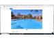 Outdoor swimming pool with lounge chairs and umbrellas, surrounded by lush landscaping and residential buildings at 1941 S Pierpont Dr # 2082, Mesa, AZ 85206