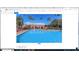 Inviting community pool surrounded by lounge chairs and palm trees, perfect for relaxation at 1941 S Pierpont Dr # 2082, Mesa, AZ 85206