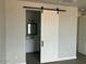 Stylish bathroom with a sliding door, bright vanity, and well-lit mirror for a modern touch at 22113 W Laura St, Wittmann, AZ 85361
