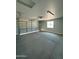 Spacious garage with concrete flooring and natural light at 22113 W Laura St, Wittmann, AZ 85361