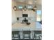 Kitchen island features a white quartz countertop, stainless steel sink, and modern pendant lighting at 22113 W Laura St, Wittmann, AZ 85361