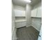 The laundry room is equipped with upper and lower cabinets and a countertop at 22113 W Laura St, Wittmann, AZ 85361