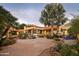 Expansive backyard with a pool, water feature, fire pit, and desert landscaping, offering a luxurious outdoor experience at 22402 N 84Th Pl, Scottsdale, AZ 85255
