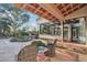 Backyard view with a covered patio, a sitting area, desert landscaping, and a luxurious pool at 22402 N 84Th Pl, Scottsdale, AZ 85255
