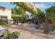 Inviting outdoor space with lush greenery, comfortable seating, and unique architectural details at 22402 N 84Th Pl, Scottsdale, AZ 85255
