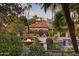 Picturesque backyard featuring a fire pit, comfortable seating, and a glimpse of the pool amidst lush landscaping at 22402 N 84Th Pl, Scottsdale, AZ 85255