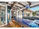 Stylish indoor bar area featuring unique tilework, ample seating, and access to the outdoor patio at 22402 N 84Th Pl, Scottsdale, AZ 85255