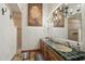 Charming bathroom with double sinks, tiled countertops, and decorative accents at 22402 N 84Th Pl, Scottsdale, AZ 85255