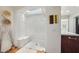 Shower with white tile, skylight, and a built-in bench at 22402 N 84Th Pl, Scottsdale, AZ 85255