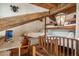 Unique bedroom with built-in bunk beds, wooden beams, and a cozy desk space, lit by a hanging pendant light at 22402 N 84Th Pl, Scottsdale, AZ 85255