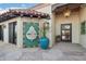 Charming entrance with decorative fountain, lush plantings, and beautiful stonework creates an inviting welcome at 22402 N 84Th Pl, Scottsdale, AZ 85255