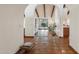 Hallway featuring Spanish tile floors, arched doorways, and views to the backyard patio at 22402 N 84Th Pl, Scottsdale, AZ 85255