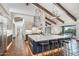 Open kitchen featuring a large island, custom lighting, breakfast bar and white cabinetry at 22402 N 84Th Pl, Scottsdale, AZ 85255