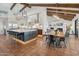 Spacious kitchen with large island, modern lighting, stainless appliances, and terracotta tile flooring at 22402 N 84Th Pl, Scottsdale, AZ 85255