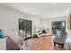 Open living space with tile floors, a fireplace, and access to the outdoors at 22402 N 84Th Pl, Scottsdale, AZ 85255