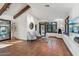 Bright living room with charming fireplace, terra cotta tile, and comfortable seating area with decorative details at 22402 N 84Th Pl, Scottsdale, AZ 85255